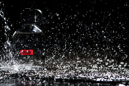 Close-up Photo of Water Drops on Bottle thumbnail