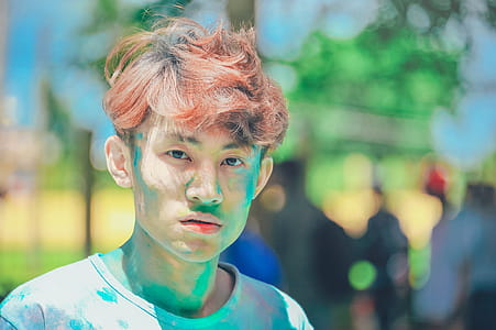 Man Covered in Green Powder in Shallow-focus Shot thumbnail
