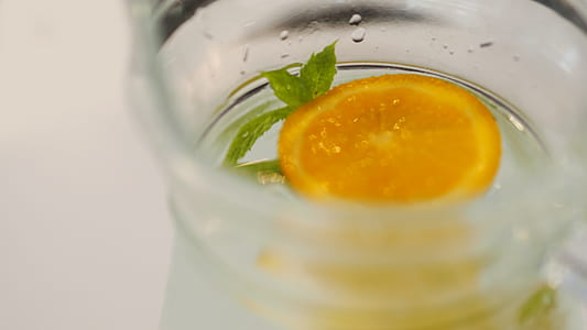 selective focus photography of water with lemon slice thumbnail