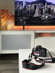 black Canon DSLR camera thumbnail