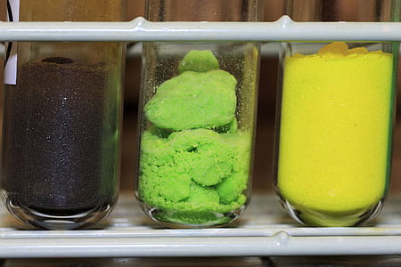 Different colored inorganic chemical salts used in a chemistry lab. thumbnail
