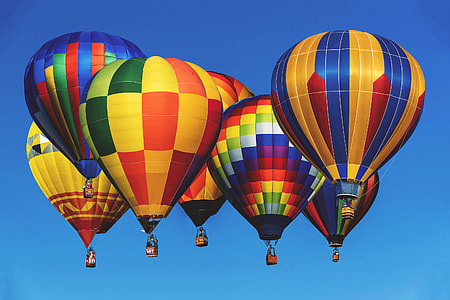 Hot air balloons in a blue sky thumbnail