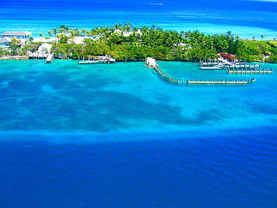 Landscape Photography of Island Surrounded Body of Water thumbnail