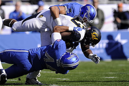 California Golden Bears player being sacked by two opposing players thumbnail