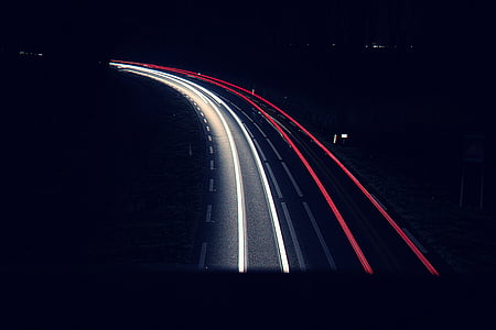 time lapse photography of vehicles on road at nighttime thumbnail