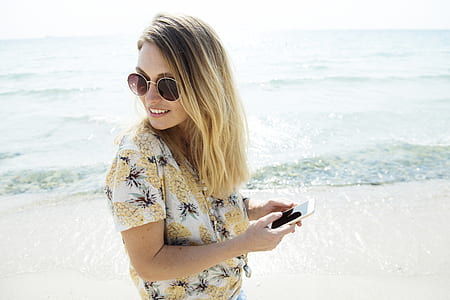 Woman Wearing Sunglasses At The Beach thumbnail