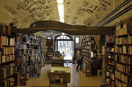 books stack on bookshelves inside room thumbnail