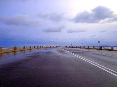 gray asphalt road during daytime thumbnail