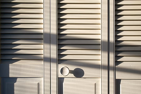 closeup photo of white wooden cabinet at daytime thumbnail