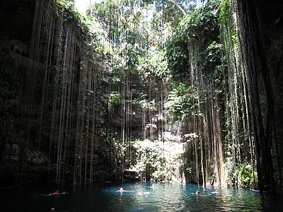 people in body of water inside cave thumbnail