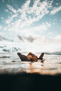 person lying down in seashore thumbnail