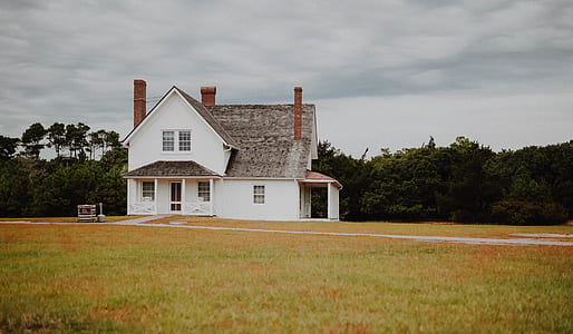 white house near trees thumbnail