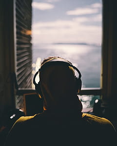 man wearing black wireless headphones thumbnail
