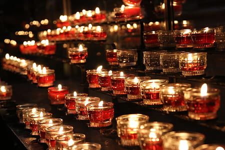 lit candles with glass holders thumbnail