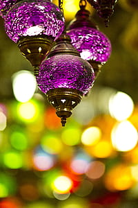 focus photography of three purple hanging decor with bokeh background thumbnail