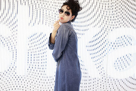 woman in blue coat thumbnail