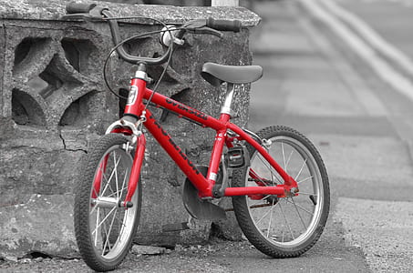 selective focus photography of red BMX bike thumbnail