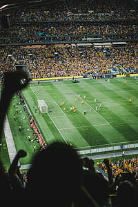 people playing soccer during daytime thumbnail