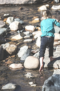 girl on rock during daytime thumbnail