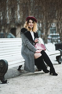 Smiling Woman Sitting On Bench thumbnail