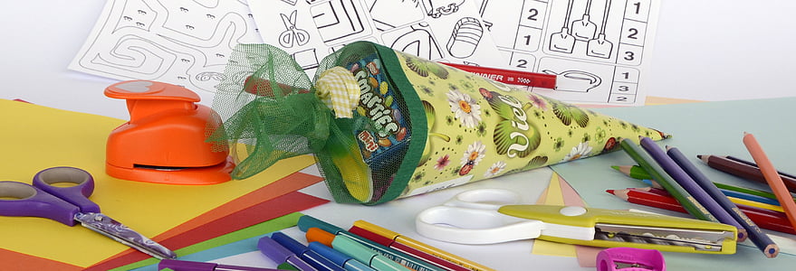 assorted colored pencils near bouquet thumbnail