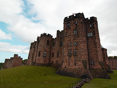 brown castle under the white cloudy sky thumbnail