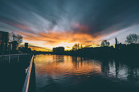 High Rise Buildings Near Body of Water during Golden Hour thumbnail
