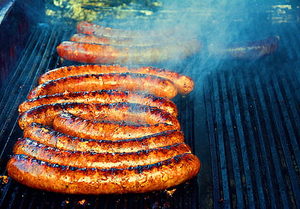 sausages being grilled thumbnail