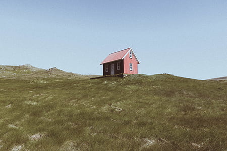 brown cabin on top of a hill thumbnail