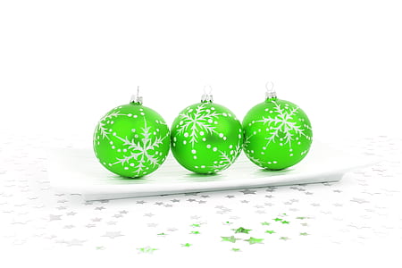 three green baubles on white surface thumbnail