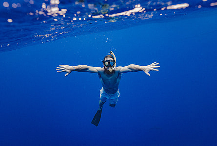 man snorkeling underwater thumbnail