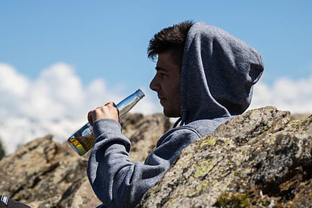 man about to drink bottle of beer thumbnail