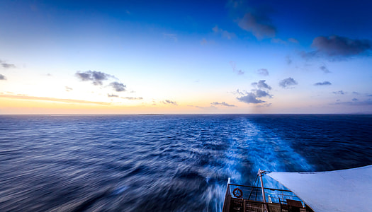 timelapse photography of sailing boat thumbnail