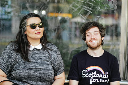 man beside woman wearing sunglasses thumbnail