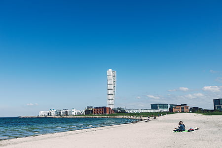two person sitting at the beach during daytime thumbnail