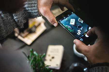 Man shooting coffee with his iPhone thumbnail