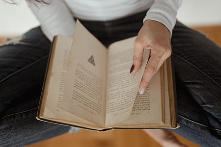 Beautiful young woman reading a book thumbnail