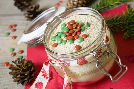 chocolate chips inside jar near brown pinecone thumbnail