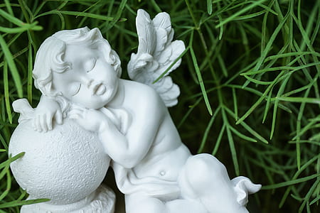 leaning cherub figurine thumbnail