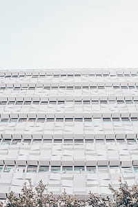 white concrete building under gray sky thumbnail