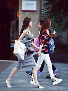 women walking beside man at daytime thumbnail