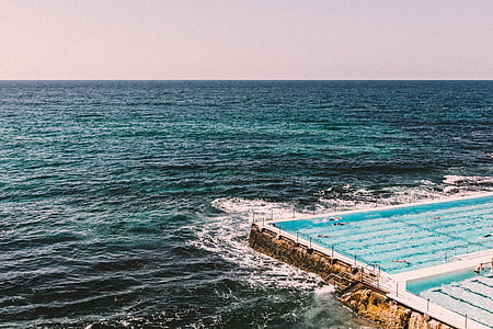 ocean waves hitting the side of the pool thumbnail
