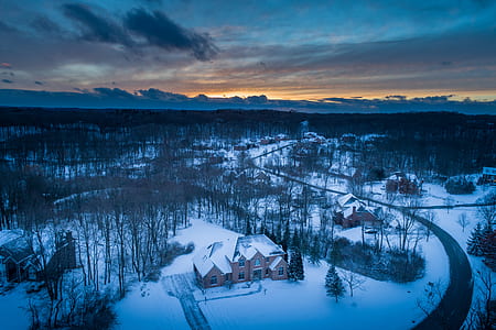 aerial photo of brown house in winter at golden hour thumbnail