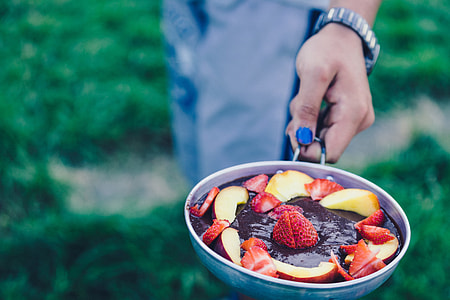 person holding out strawberry and apple dessert thumbnail