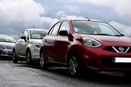red Nissan sedan thumbnail