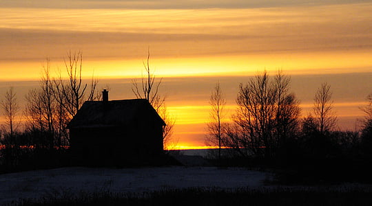 silhouette of house during golden hour thumbnail