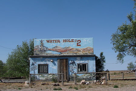 photo of blue water hole concrete house thumbnail
