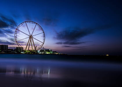 Photography Of Ferris Wheel Near Body Of Water thumbnail