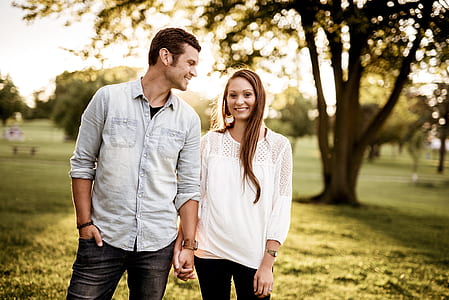 man and woman standing near each other thumbnail