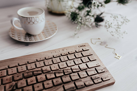 Wooden keyboard and cup of coffee thumbnail